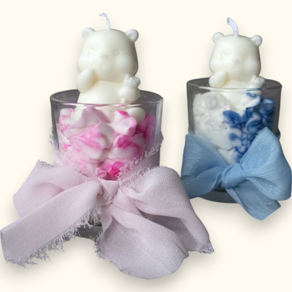 Pink and blue bear candles in glass jars with bows by Studio S0